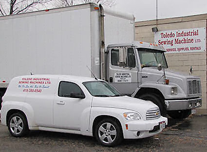 View of Toledo Industrial Sewing Machines building and trucks